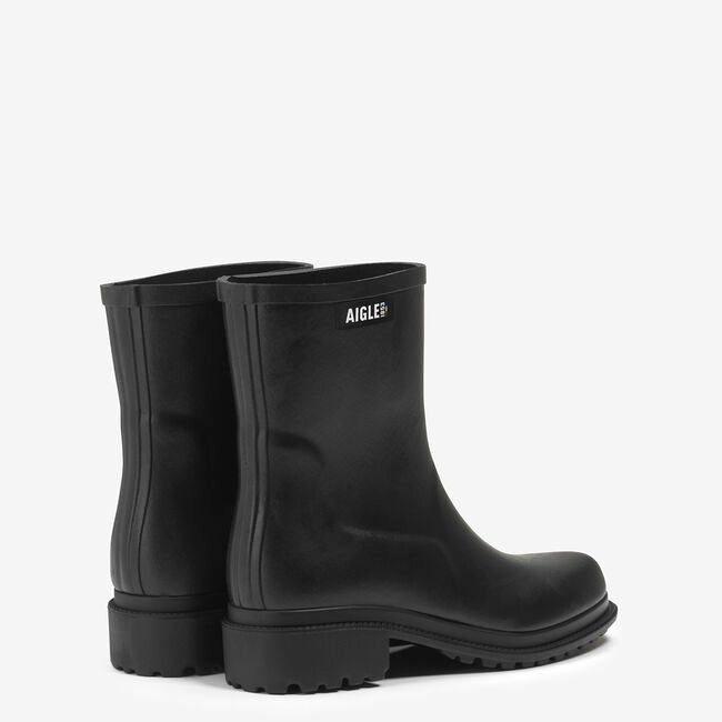 Black rubber boots with Aigle logo on a white background