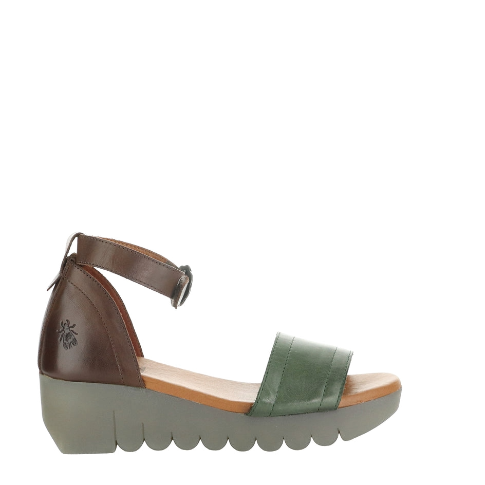 Green sandal with brown strap on a white background