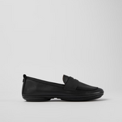 Black loafer shoe on a light gray background
