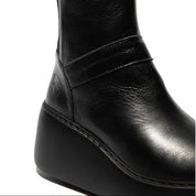 Black leather ankle boot on a white background
