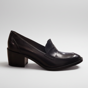 Black leather shoe on a white background