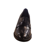 Black leather loafer shoe on a white background