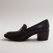Black leather shoe on a white background
