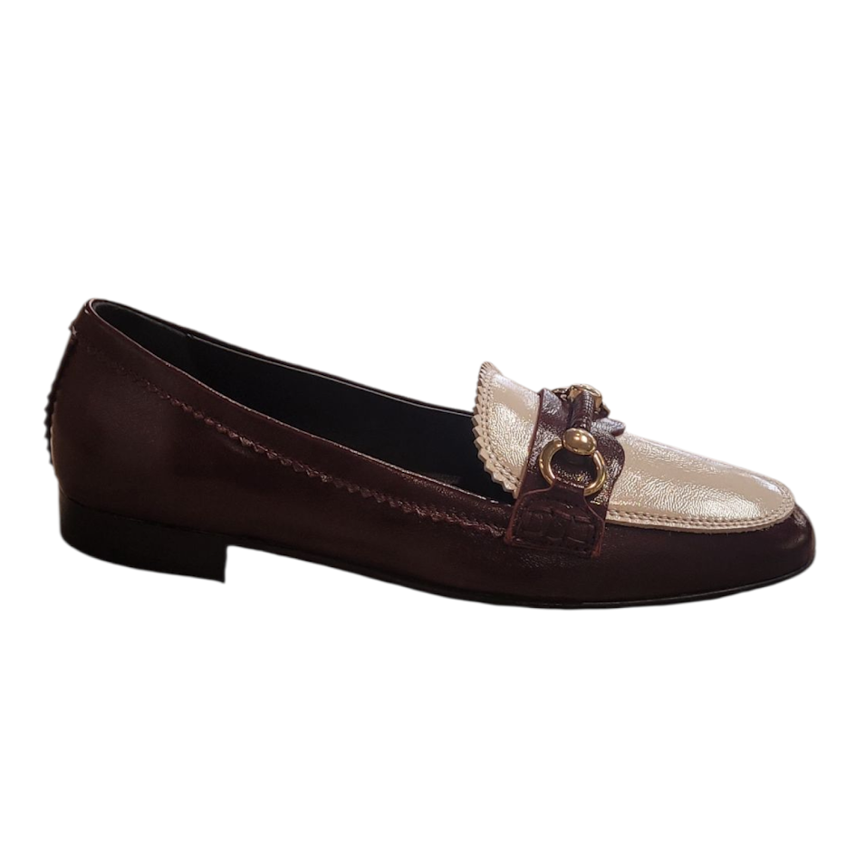 Burgundy loafer with gold buckle on a white background
