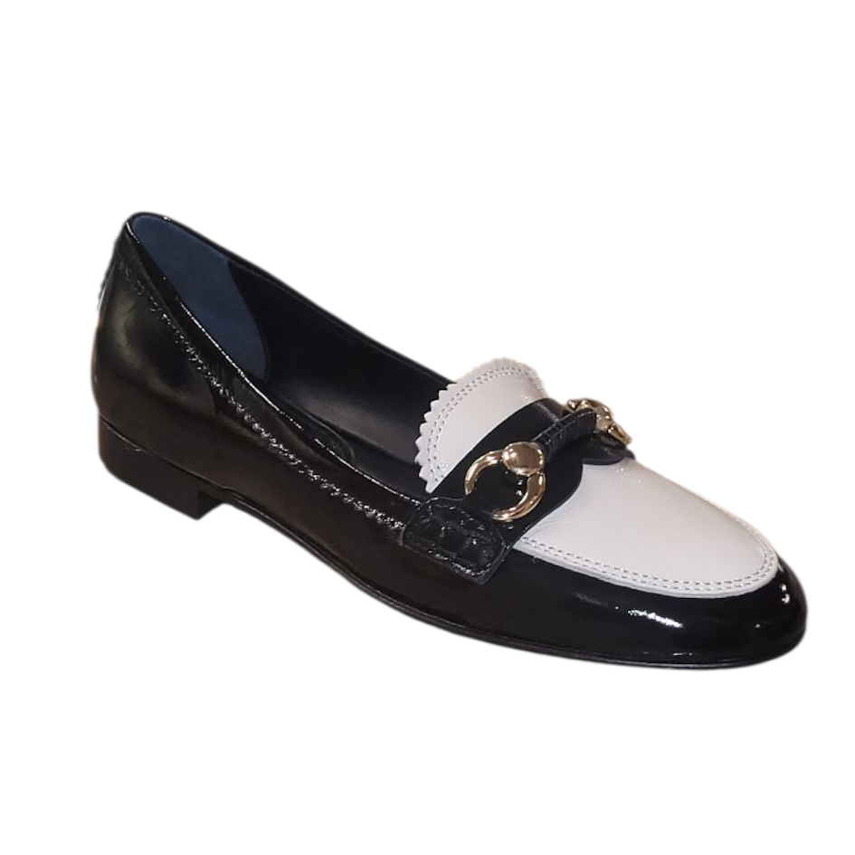 Black and white loafer shoe with a gold buckle on a white background