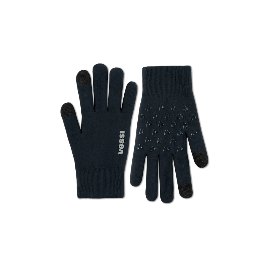 Pair of blue gloves with 'Vessi' branding on a white background
