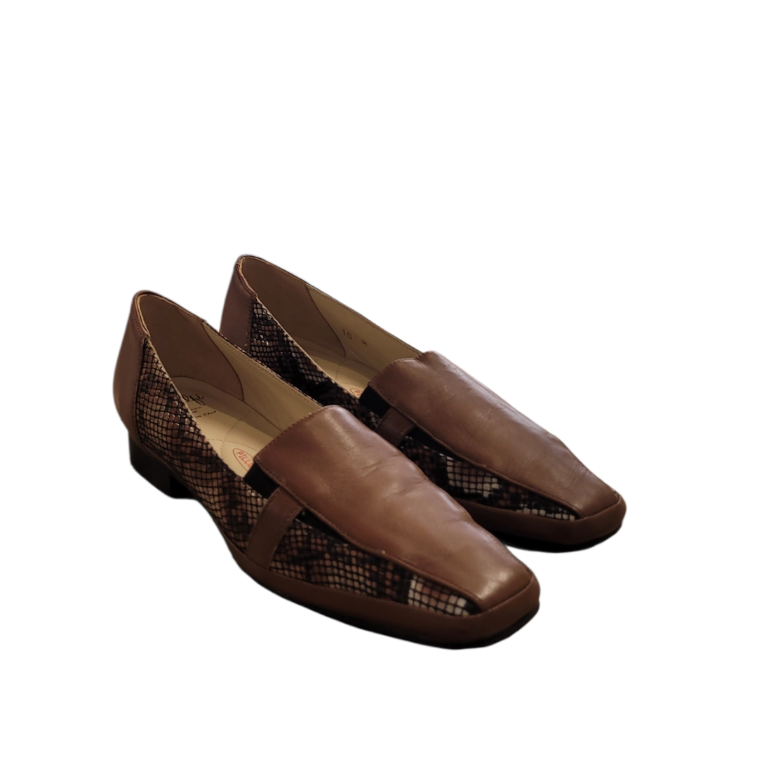 Pair of brown shoes on a white background