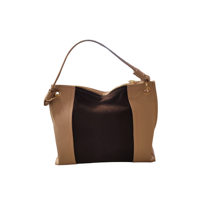 Two-tone handbag with brown and black sections on a white background