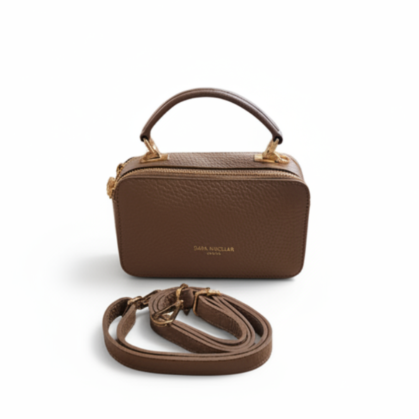 Taupe handbag with a strap on a white background