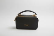Green handbag with gold zipper on a white background