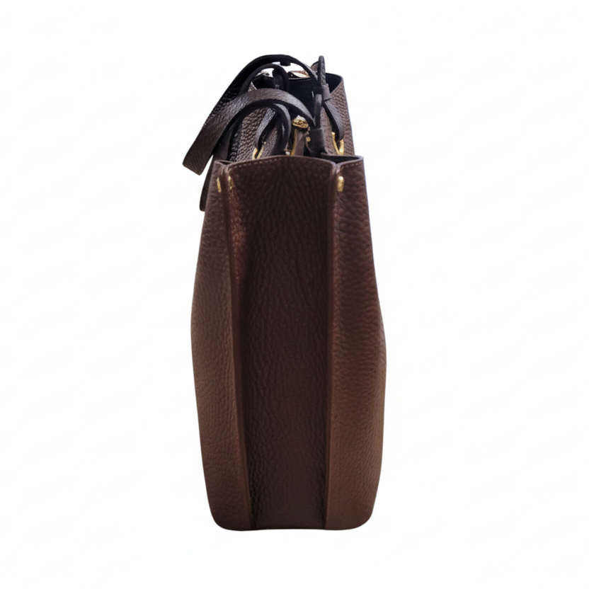 Brown leather handbag with a strap on a white background