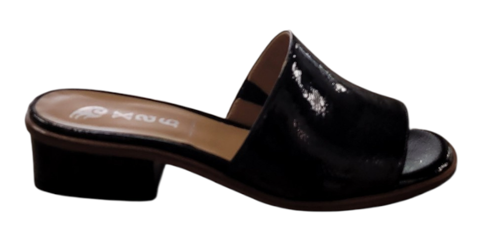 Black patent leather sandal with a block heel on a white background