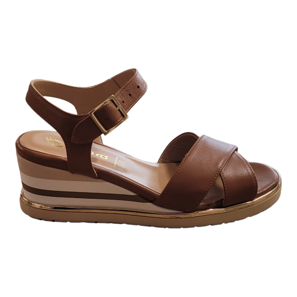 Brown wedge sandal on a white background