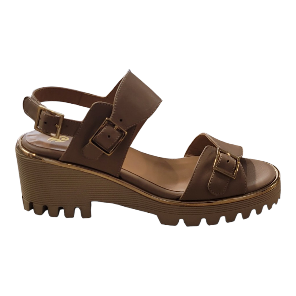 Beige sandal with thick sole on a white background