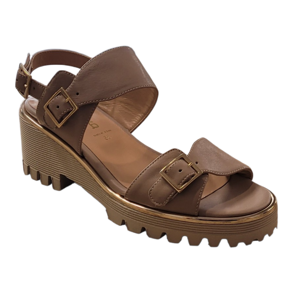 Beige sandal with platform sole on a white background