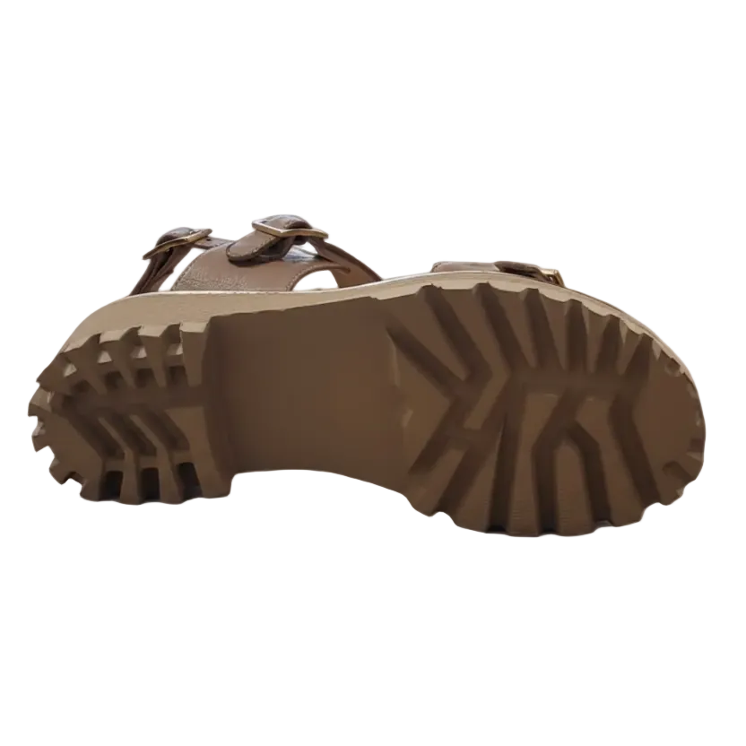Beige sandal sole with tread pattern on a white background