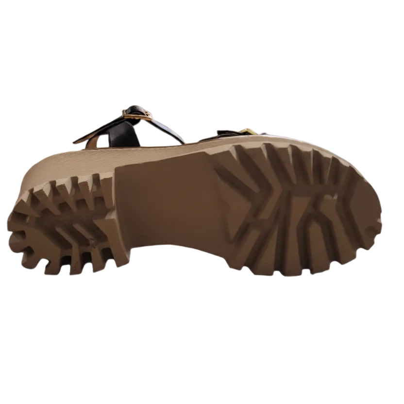 Brown sandal sole with tread pattern on a white background