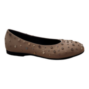 Beige flat shoe with studded details on a white background