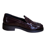 A single dark brown patent leather loafer with a glossy finish and a black platform sole, shown from a side profile on a white background.