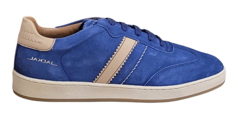 A blue suede Jackal sneaker with beige contrast stitching, a beige heel tab, and a beige midsole, shown from a side profile on a white background.