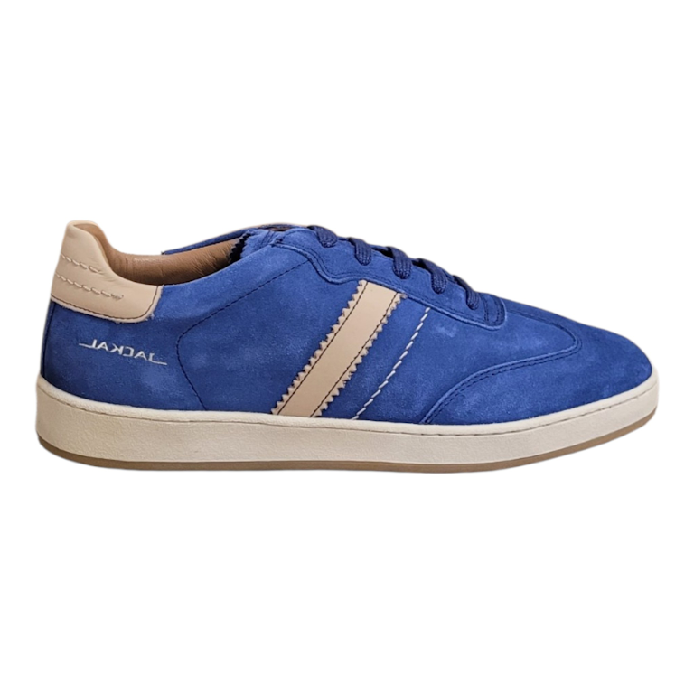 A blue suede Jackal sneaker with beige contrast stitching, a beige heel tab, and a beige midsole, shown from a side profile on a white background.