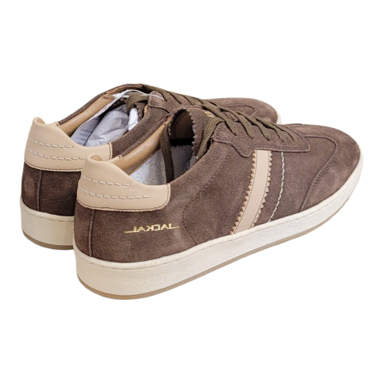 A pair of Jackal brand low-top sneakers in brown suede with beige side stripes and heel tabs, featuring a cream-colored midsole and a gold 'JACKAL' logo on the side.