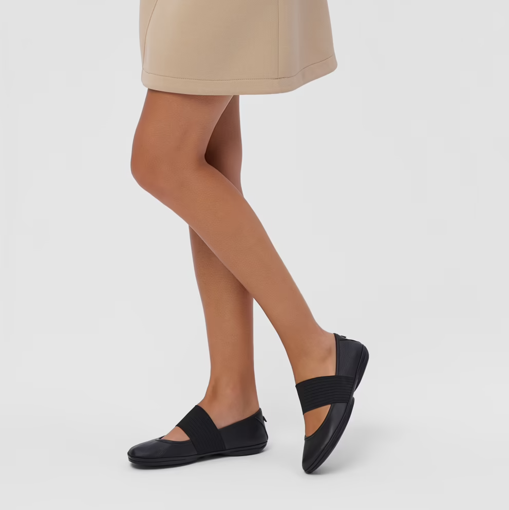 Beige skirt worn by a person on a white background