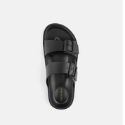 Black sandal with a strap on a white background