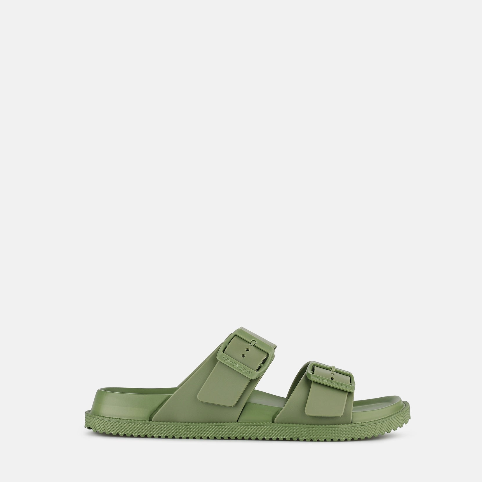 Green sandal with two straps on a white background
