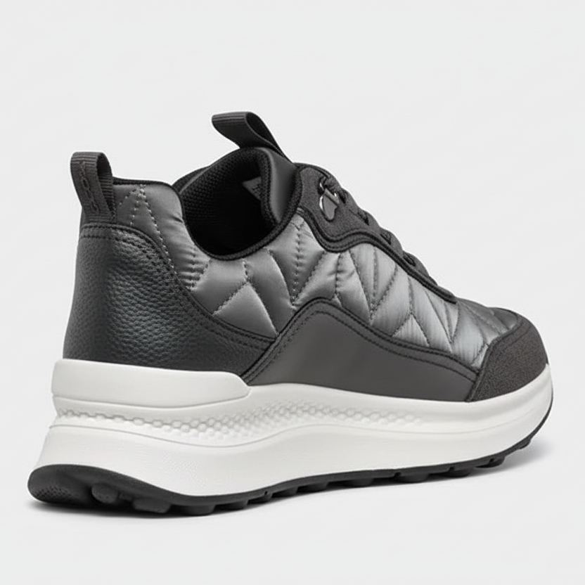 Gray quilted sneaker with white sole on a white background