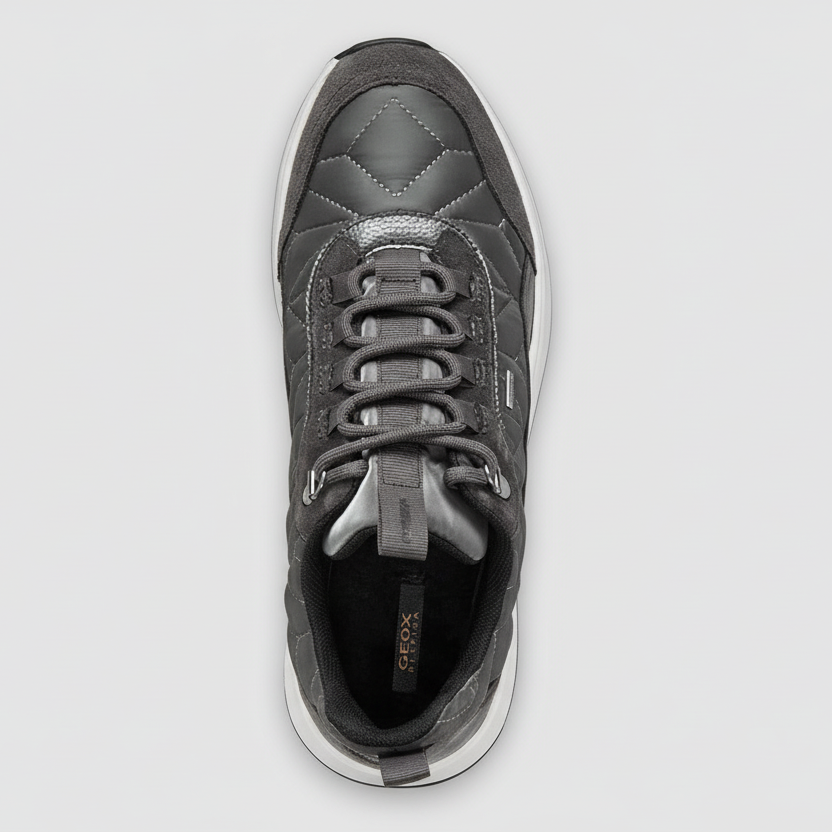 Gray sneaker with lace-up design on a white background