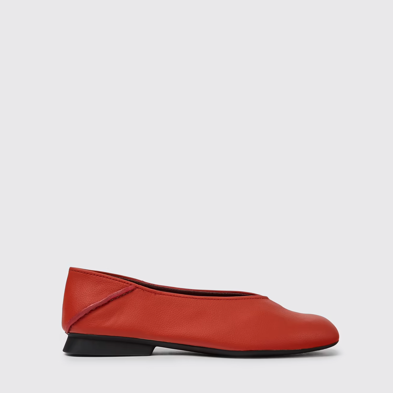 Red flat shoe on a light gray background