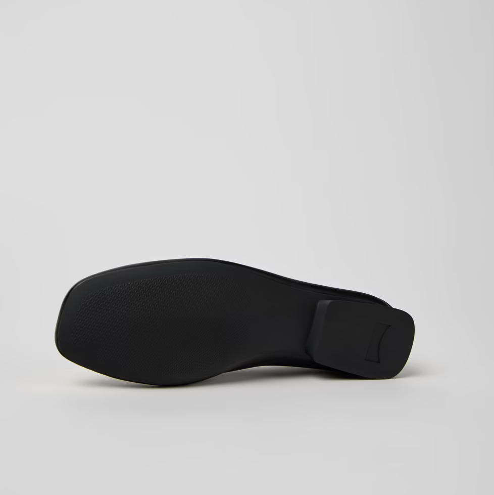 Black shoe sole on a light gray background