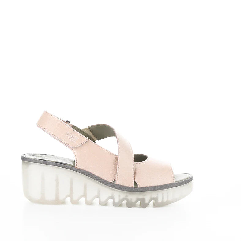 Pink sandal with a thick sole on a white background