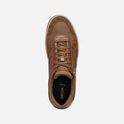 Brown sneaker with Geox branding on a white background