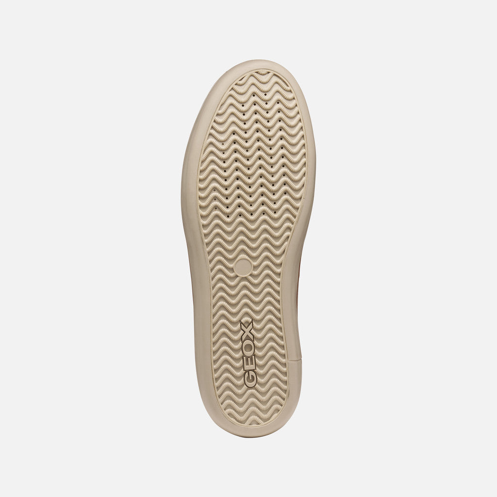 Beige sole of a shoe with 'Geox' branding on a light gray background