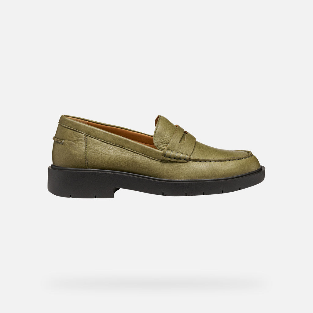 Green loafer shoe on a white background