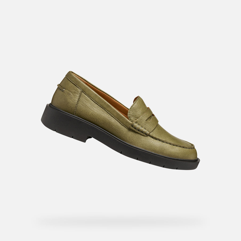 Green loafer shoe on a white background