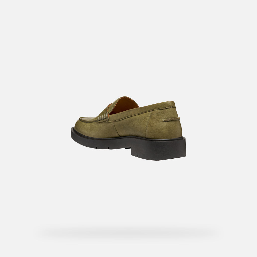 Green loafer shoe on a white background