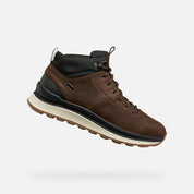 Brown leather boot with black accents on a white background