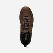 Brown leather boot with laces on a white background