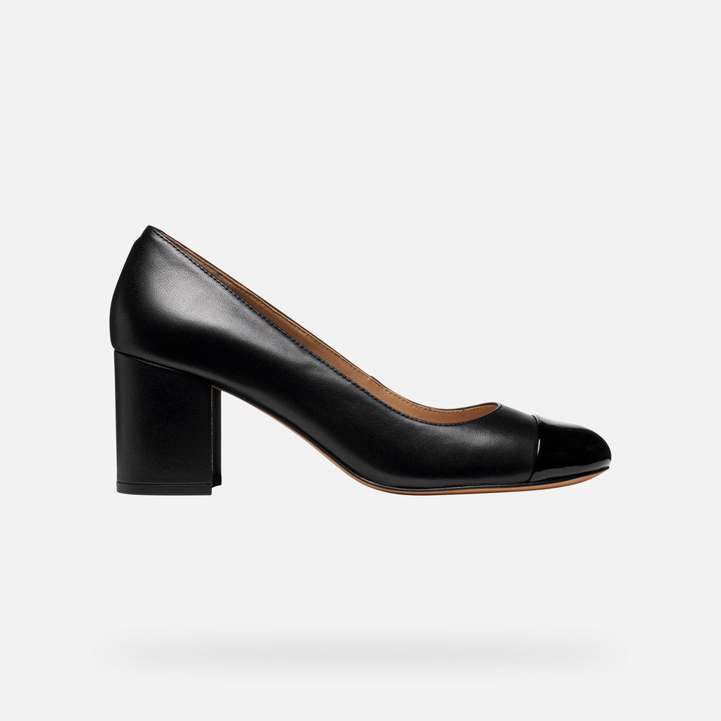 Black leather pump on a white background