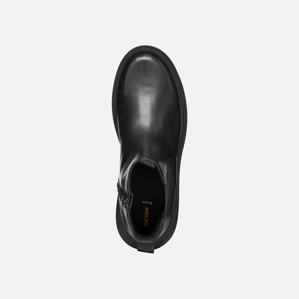 Black leather shoe on a white background