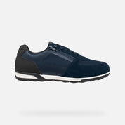 Navy sneaker with white sole on a white background