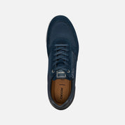 Navy blue sneaker with brand logo on a light gray background