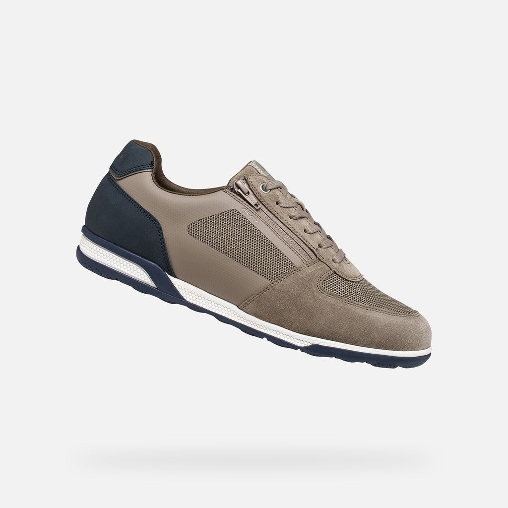 Grey and navy sneaker on a light gray background