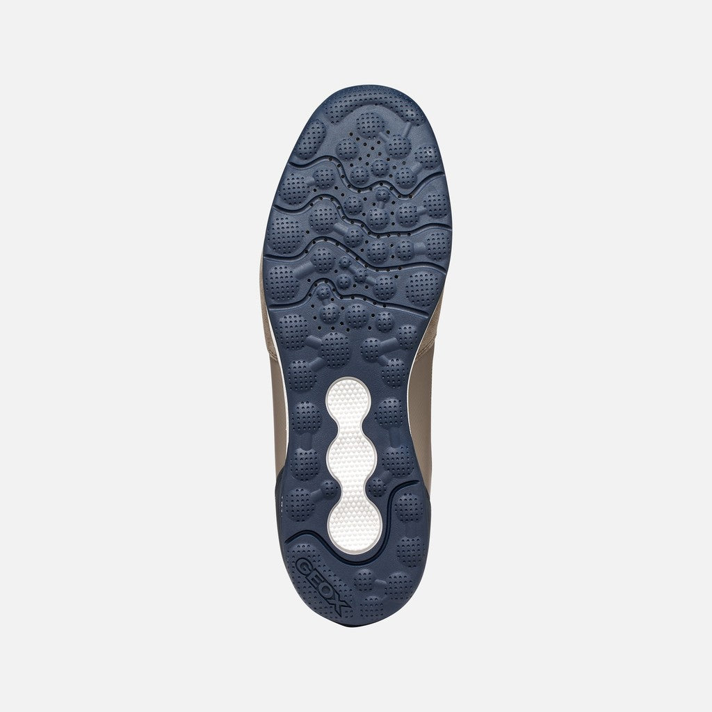 Sole of a shoe with Geox logo on a light gray background