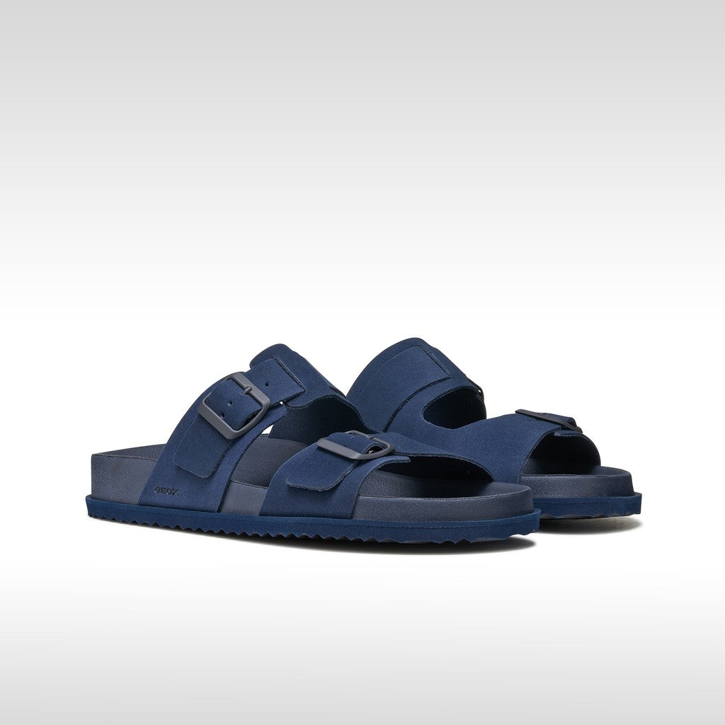 Pair of blue sandals on a white background