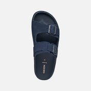 Navy blue sandal with a buckle on a white background