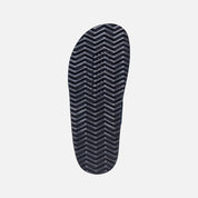 Black shoe sole with a zigzag pattern on a white background